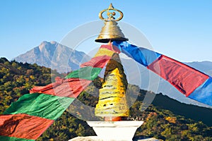 Colorful Flags over a Pagoda in the Himalaya Mountains in the Kingdon Bhutan photo