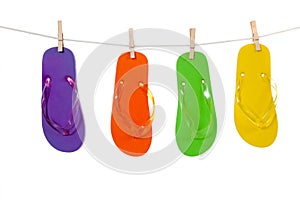 Colorful flip-flop sandles on a Clothesline
