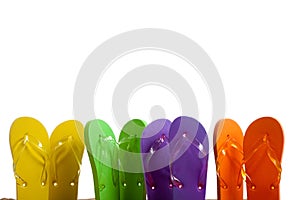 Colorful Flip-Flop Sandles on a Sandy Beach