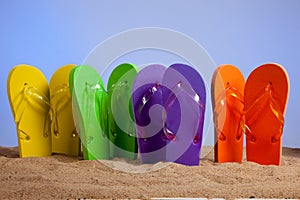 Colorful Flip-Flop Sandles on a Sandy Beach photo