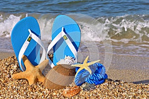 Colorful flip flops, starfish, coconut and rope.