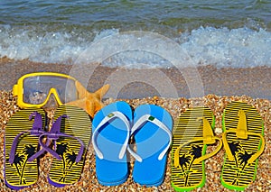 Colorful flip flops, starfish and underwater mask.