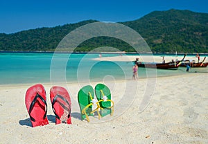 Colorful flipflop sandals on beach