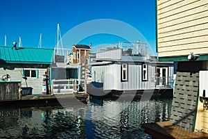 Colorful floating homes in the harbour.Economical living in overcrowded city