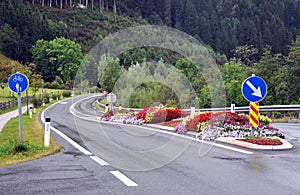 Colorful floral island on the road.