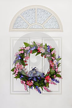 Colorful Floral Summer Wreath Hanging on White Door