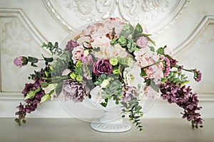 Colorful flower arrangement centerpiece in glass vase