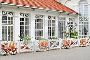 Colorful flower arrangements for wedding party, Raudondvaris orangery restaurant Lithuania