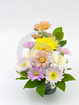 Colorful flower bouquet arrangement in vase isolated on white