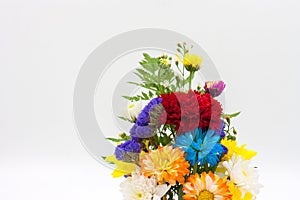 Colorful flower bouquet arrangement in vase on white ba