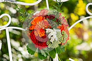 Colorful flower bouquet with dalias on a trellis photo