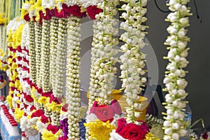 Colorful flower garlands are sold near the temple for traditional ceremonies