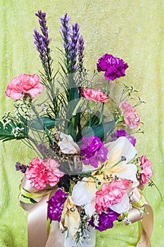 Colorful flowers bouquet on green