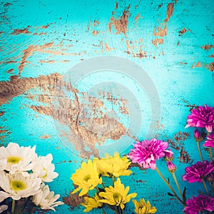 Colorful flowers bouquet on vintage wooden background,