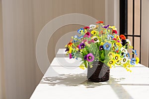 Colorful Flowers in Brown Wood Basket Beside Glass Window