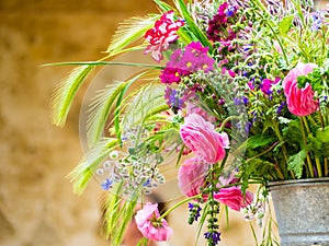 Colorful flowers in a metal container