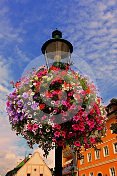 Colorful flowers on street lamp