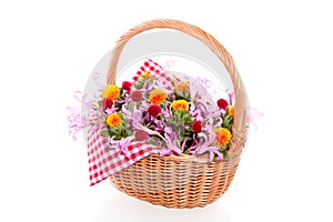 Colorful flowers in a wicker basket