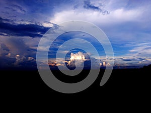 Colorful fluffy clouds in blue sky. blue sky with clouds and sun reflection.The sun shines bright in