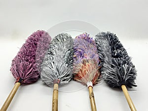 Colorful Fluffy Cute Feather Duster Synthetic Fabric Materials for Home Interior Cleaning Tools in White Isolated Background