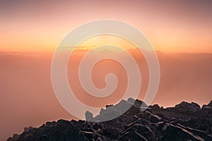 Colorful foggy sunrise over the mountains in High Tatras, Slovakia