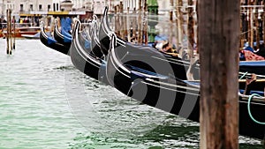 Colorful footage of Venecian gondolas rocking on the water