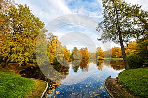 Colorful forest and lake in fall season.