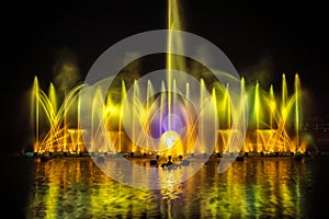 The colorful fountain dancing in celebration of year with dark night sky background.