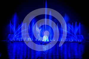 The colorful fountain dancing in celebration of year with dark night sky background.