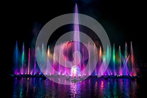 The colorful fountain dancing in celebration of year with dark night sky background.