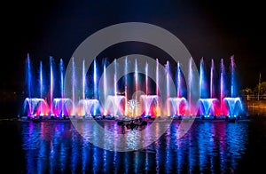 The colorful fountain dancing in celebration of year with dark night sky background.