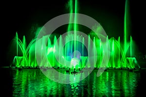 The colorful fountain dancing in celebration of year with dark night sky background.