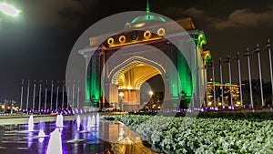Colorful fountain at the gate to Emirates Palace night timelapse, UAE.