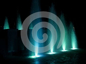 Colorful fountain at night - turquoise Stock Photo