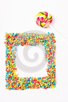 Colorful frame candy, lollipop and sweets isolated on white background. Top view. Selective focus