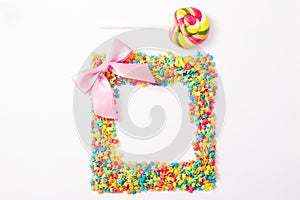 Colorful frame candy, lollipop and sweets isolated on white background. Top view. Selective focus