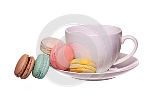 Colorful French Macarons with Cup of Tea isolated