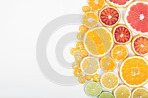 Colorful fresh citrus fruit on white background. Orange, tangerine, lime, blood orange, grapefruit. Fruit background. Summer food