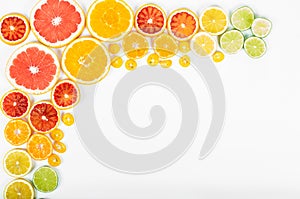 Colorful fresh citrus fruit on white background. Orange, tangerine, lime, blood orange, grapefruit. Fruit background. Summer food
