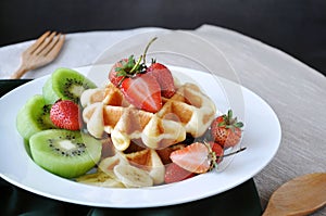 Colorful Fresh Fruits Top on Waffle Dish