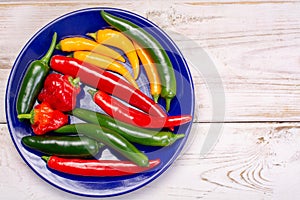 Colorful fresh hot Mexican chili peppers in assortment top view