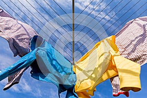 Colorful fresh laundry hanging outside on clothes line