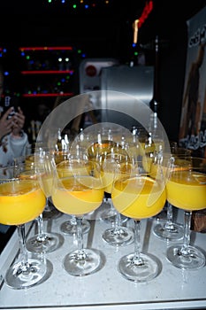 Colorful Fresh Orange Juice Cocktails Served at Nightclub Bar