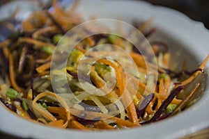 Colorful fresh root vegetables salad, containing beetroot, carrot, Kohlrabi and more