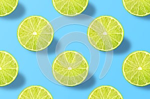 Vivid fruit pattern of fresh lime on colourful background photo