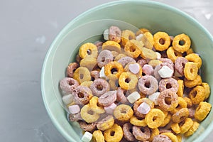 Colorful fruit loops in a bowl, close-up