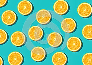 Colorful fruit pattern of fresh orange slices on green background top view orange fruit pattern background Flat lay orange backgro