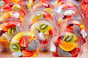 Colorful fruit salad in transparent glasses