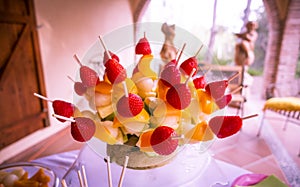 Colorful fruit skewers, with shallow depth of field.