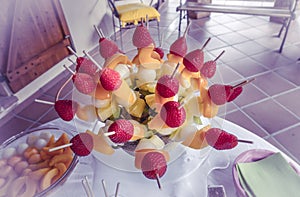 Colorful fruit skewers, with shallow depth of field.